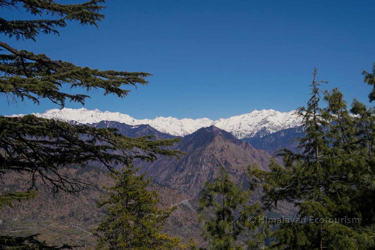 view of snow mountains from Tirthan valley