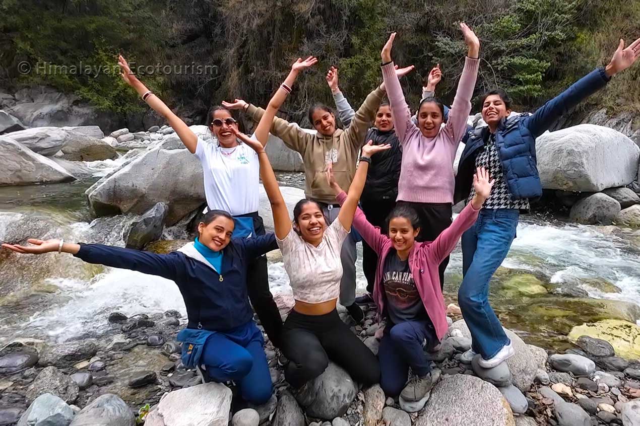 Himalayan Ecotourism's women trek staff by the Tirthan river