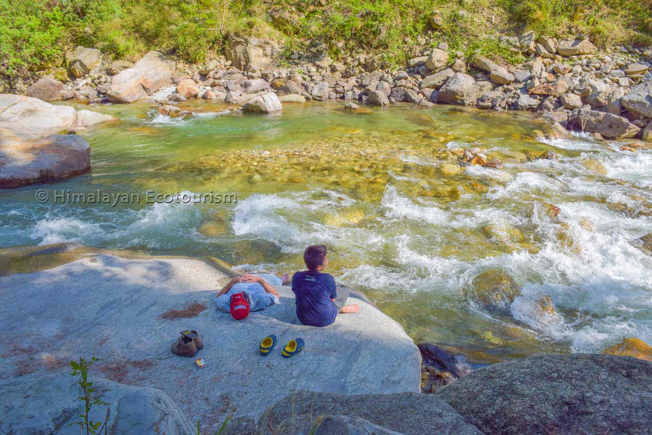 Relax by the Tirthan river on easy camping tour